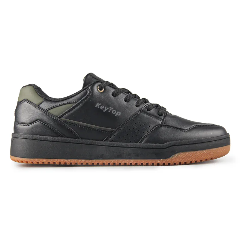 Black low-top casual shoe with a gum-look sole