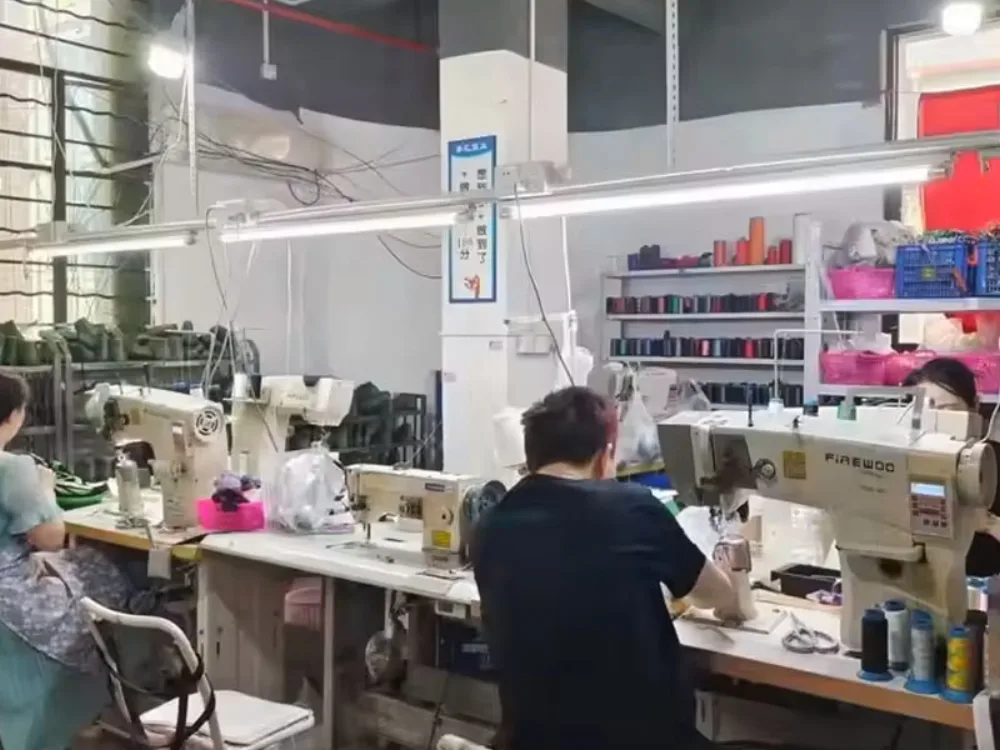 Footwear sample room with stitching workstations and thread storage